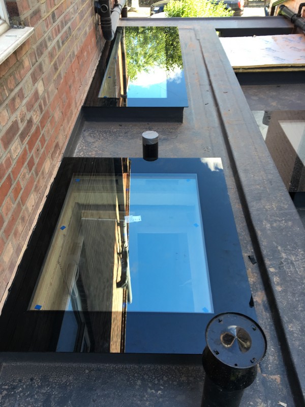 Multiple flat roof skylights on extension in Sutton